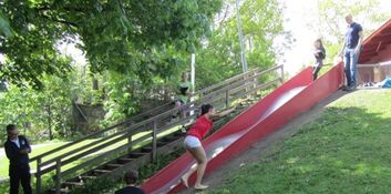 Sliding on a wet slide